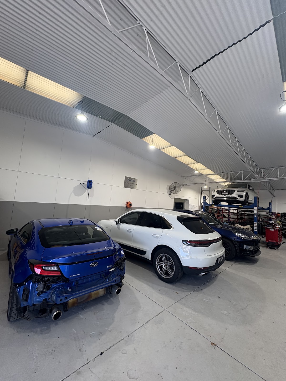 Notts ADAS workshop with vehicles and diagnostic equipment